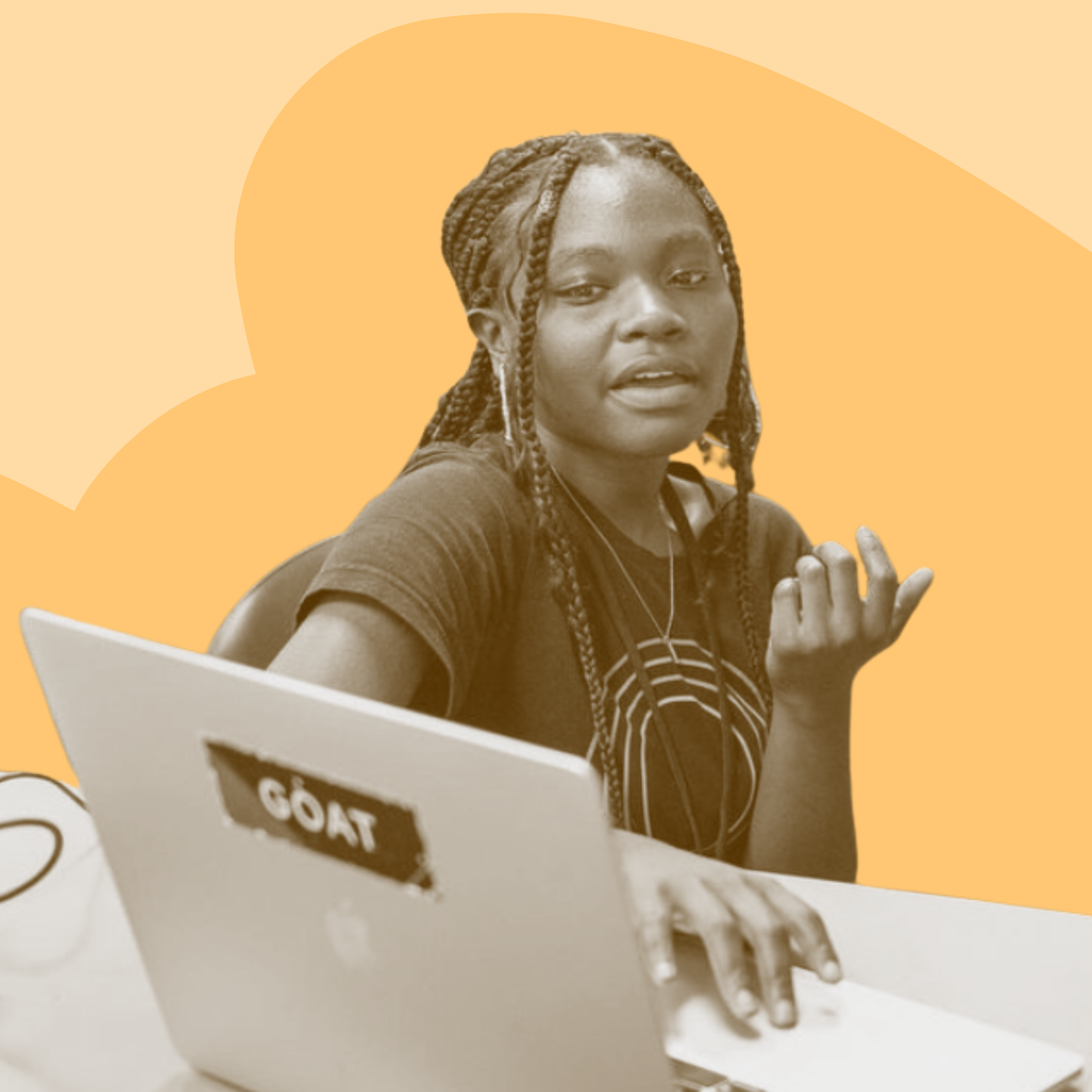 Person sitting at a desk with a laptop, wearing headphones, gesturing while speaking.